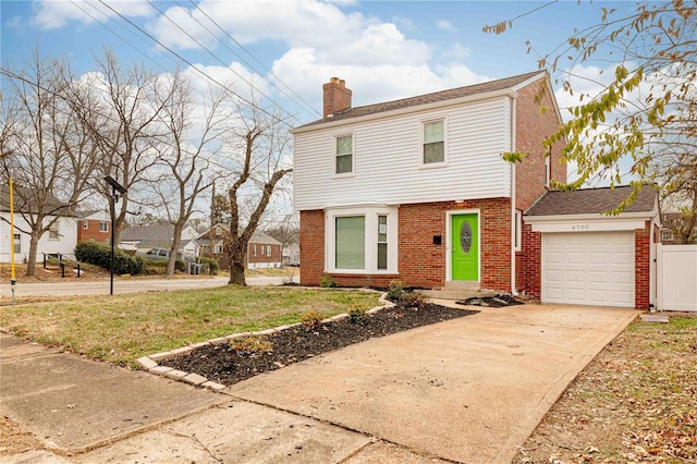 view of front facade with a front yard and a garage