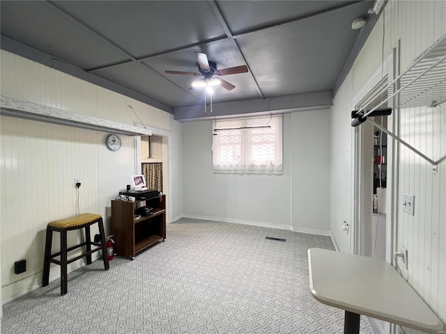 basement with ceiling fan