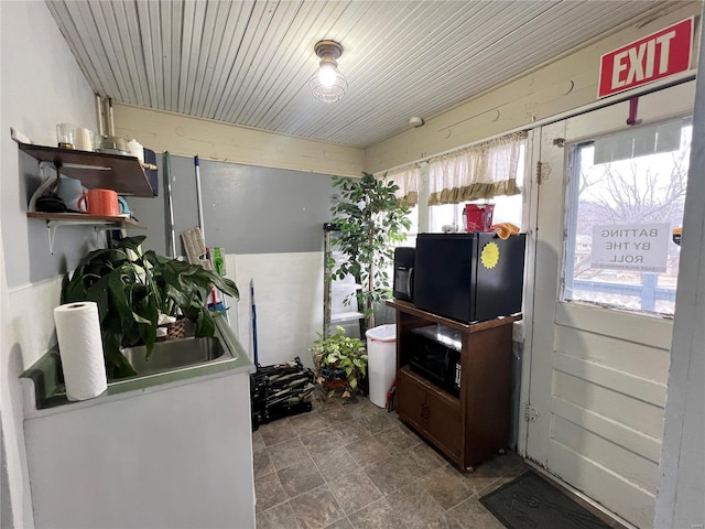 miscellaneous room with wood ceiling