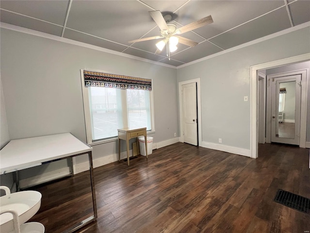 bedroom featuring ceiling fan, ornamental molding, and dark hardwood / wood-style flooring