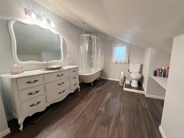 full bathroom with toilet, vaulted ceiling, a textured ceiling, vanity, and hardwood / wood-style floors