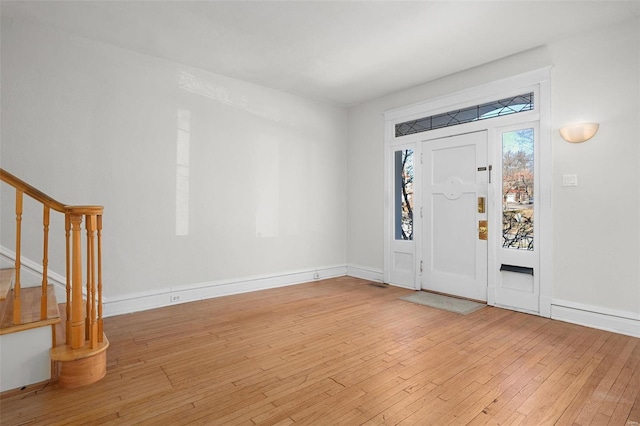 foyer entrance with light hardwood / wood-style floors