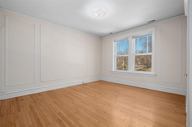 spare room with light wood-type flooring