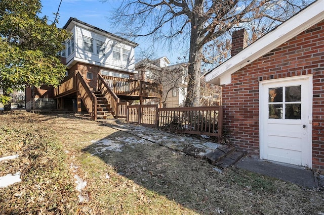 view of yard featuring a wooden deck