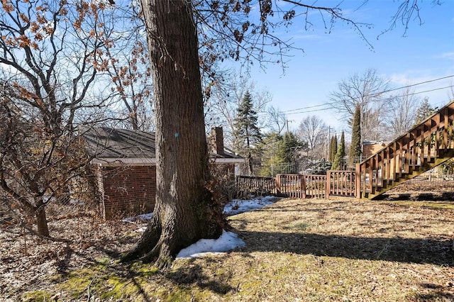 view of yard featuring a wooden deck