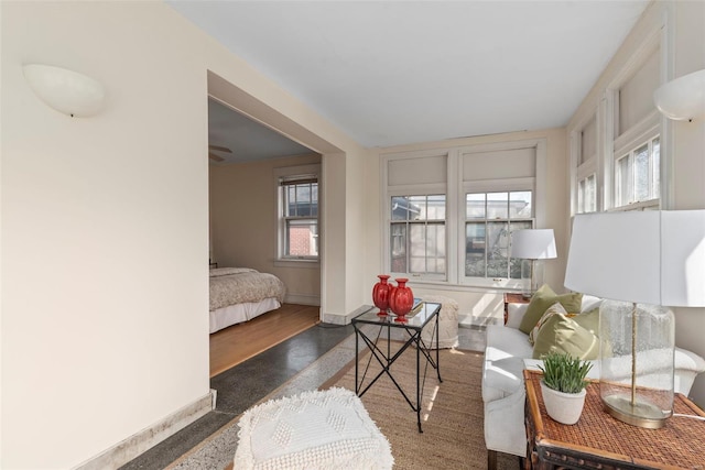 interior space featuring baseboards and wood finished floors