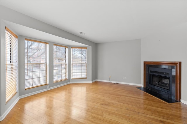 unfurnished living room featuring light wood-type flooring