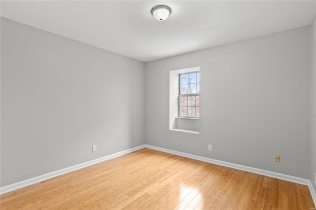 empty room with wood-type flooring