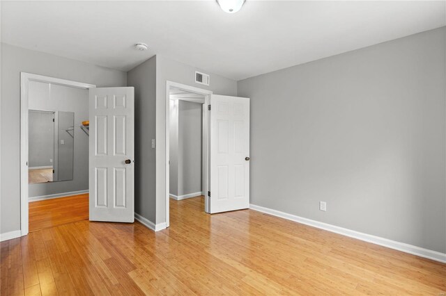 unfurnished bedroom with light hardwood / wood-style flooring