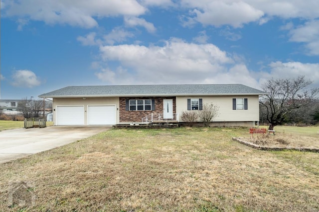 single story home with a garage and a front yard