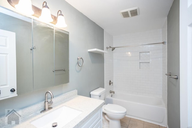 full bathroom featuring tile patterned flooring, vanity, toilet, and tiled shower / bath combo