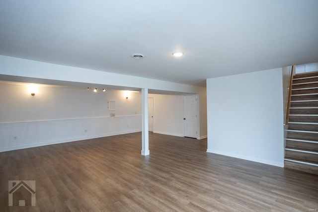 basement with dark wood-type flooring