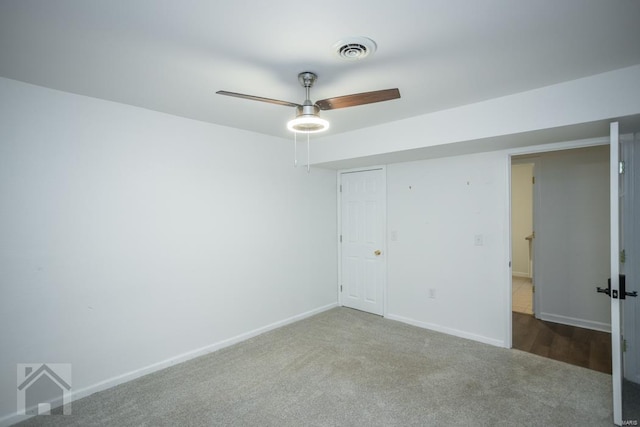 carpeted empty room with ceiling fan