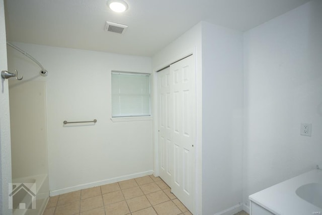 bathroom featuring tile patterned flooring, vanity, and tub / shower combination