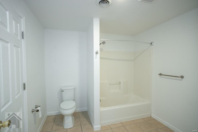 bathroom featuring tile patterned floors, toilet, and shower / bathing tub combination