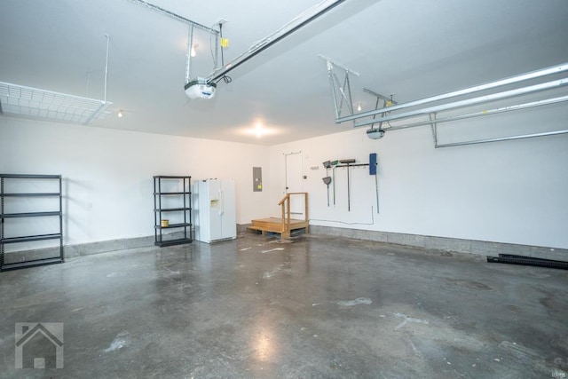 garage with electric panel, a garage door opener, and white refrigerator with ice dispenser