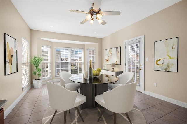 dining room featuring tile patterned flooring, ceiling fan, and a wealth of natural light