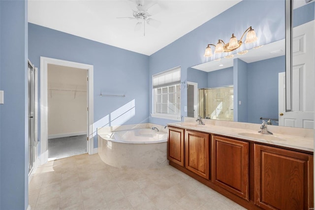 bathroom with vanity, ceiling fan, and plus walk in shower