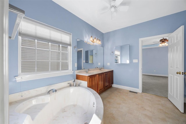 bathroom featuring ceiling fan, vanity, and a bath