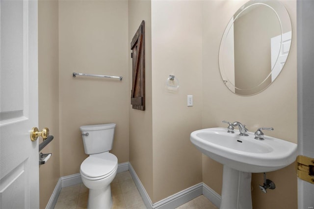 bathroom with tile patterned floors and toilet