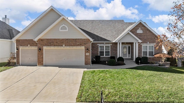 view of front of property featuring a garage and a front lawn