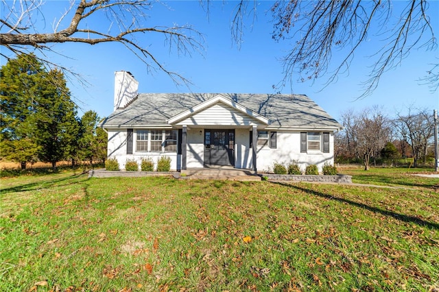 ranch-style house with a porch and a front lawn