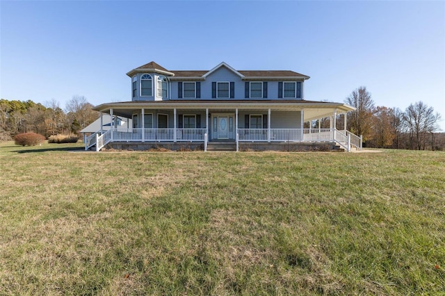 farmhouse featuring covered porch and a front lawn