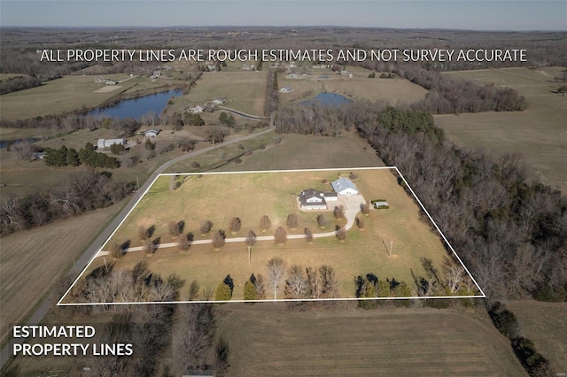 aerial view with a rural view and a water view