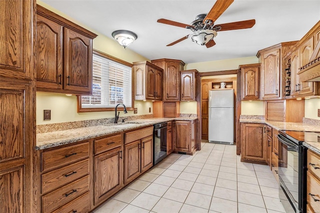 kitchen with black appliances, ceiling fan, light tile patterned flooring, and sink