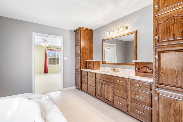 bathroom with ceiling fan and vanity