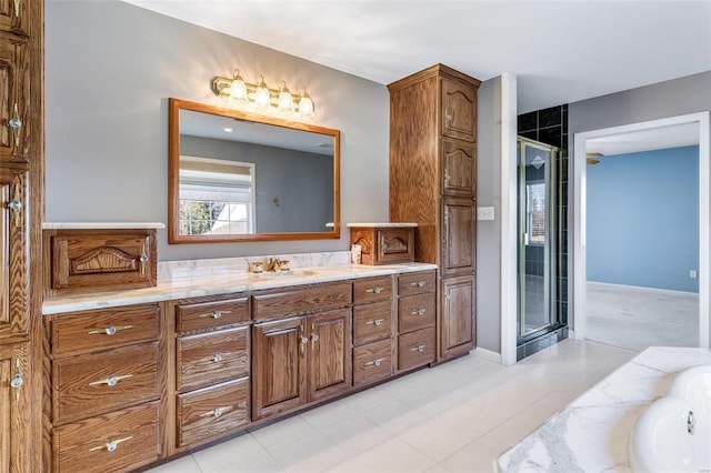 bathroom with vanity and separate shower and tub