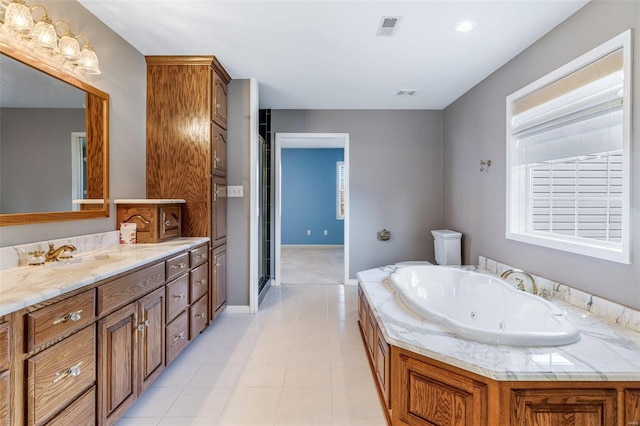 bathroom with a bathing tub and vanity