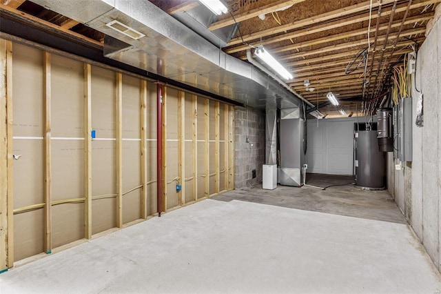 basement with gas water heater and heating unit