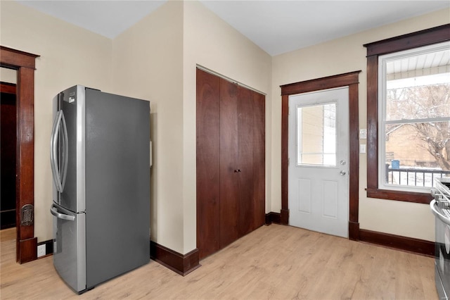 entrance foyer featuring plenty of natural light and light wood-type flooring