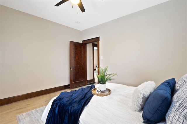 bedroom featuring ceiling fan and light wood-type flooring