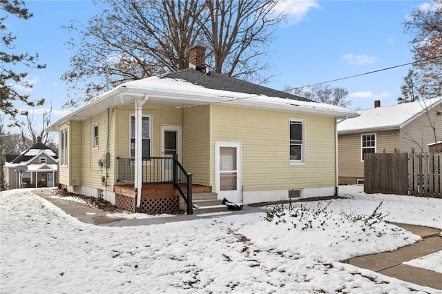 view of snow covered house