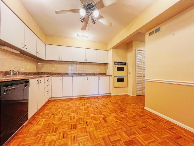 kitchen with sink, black dishwasher, double oven, white cabinetry, and light parquet flooring