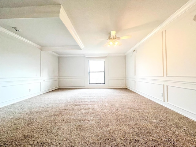 empty room featuring carpet floors and crown molding