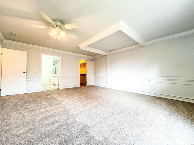 carpeted empty room with ceiling fan and ornamental molding