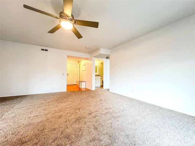 carpeted empty room with ceiling fan