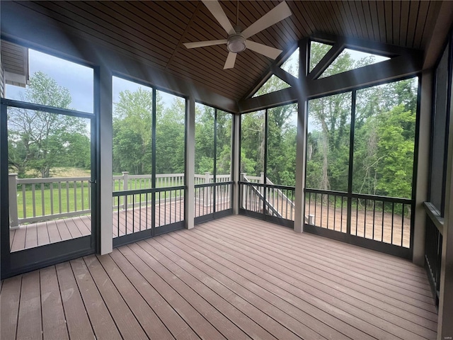 unfurnished sunroom with a wealth of natural light, ceiling fan, and lofted ceiling