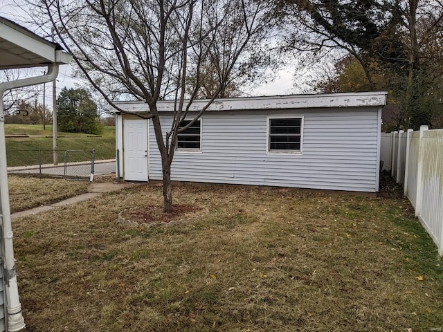 view of property exterior with a lawn