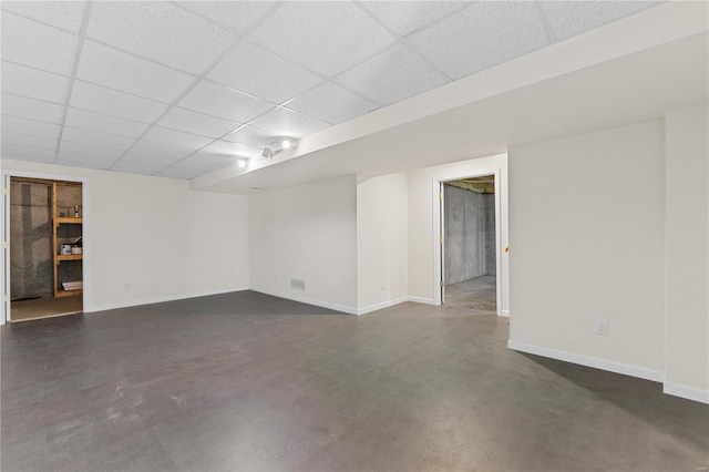 basement featuring a paneled ceiling