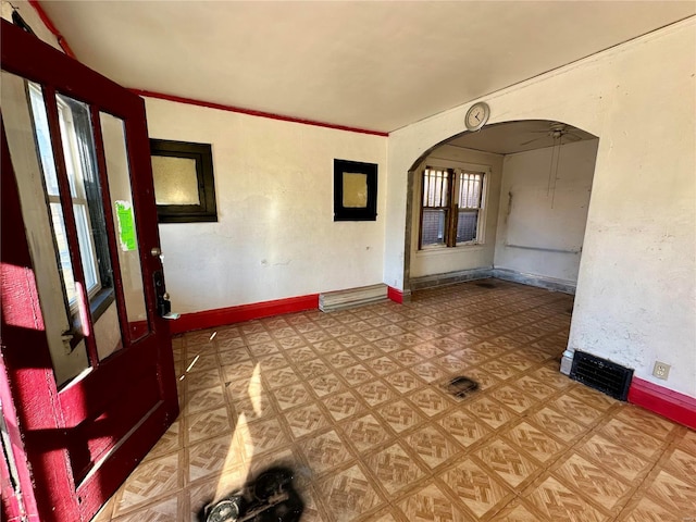 unfurnished room with ceiling fan