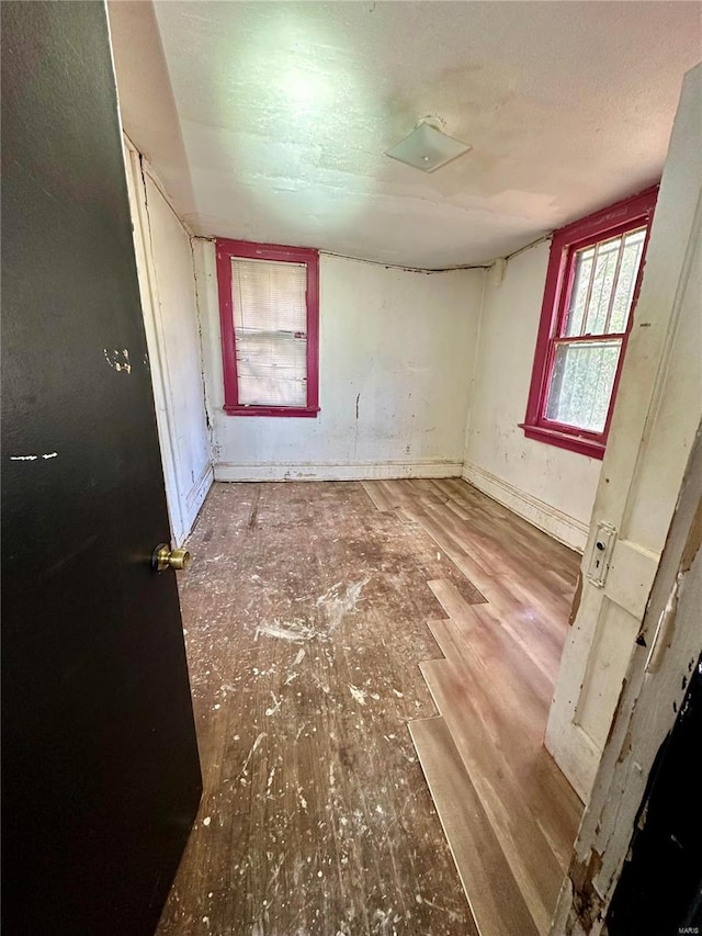 bedroom with hardwood / wood-style floors