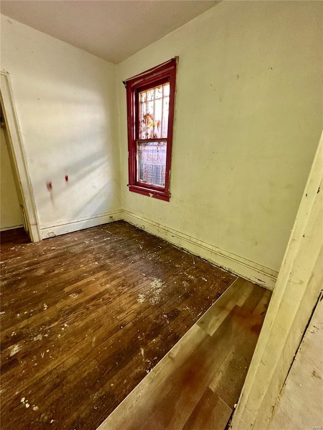 spare room featuring hardwood / wood-style flooring