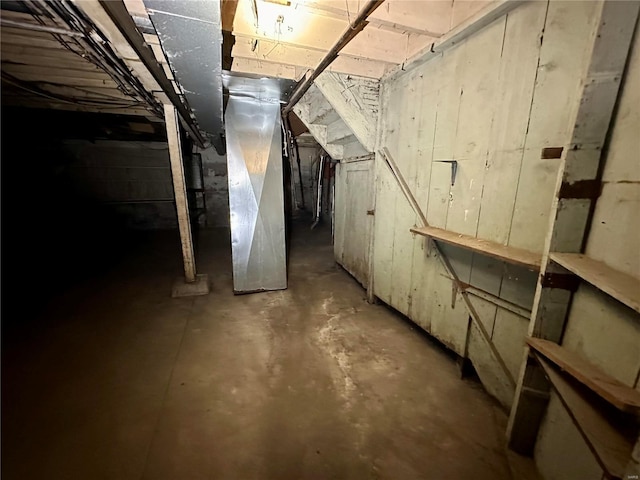 basement featuring heating unit