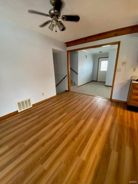 unfurnished room with hardwood / wood-style flooring and ceiling fan