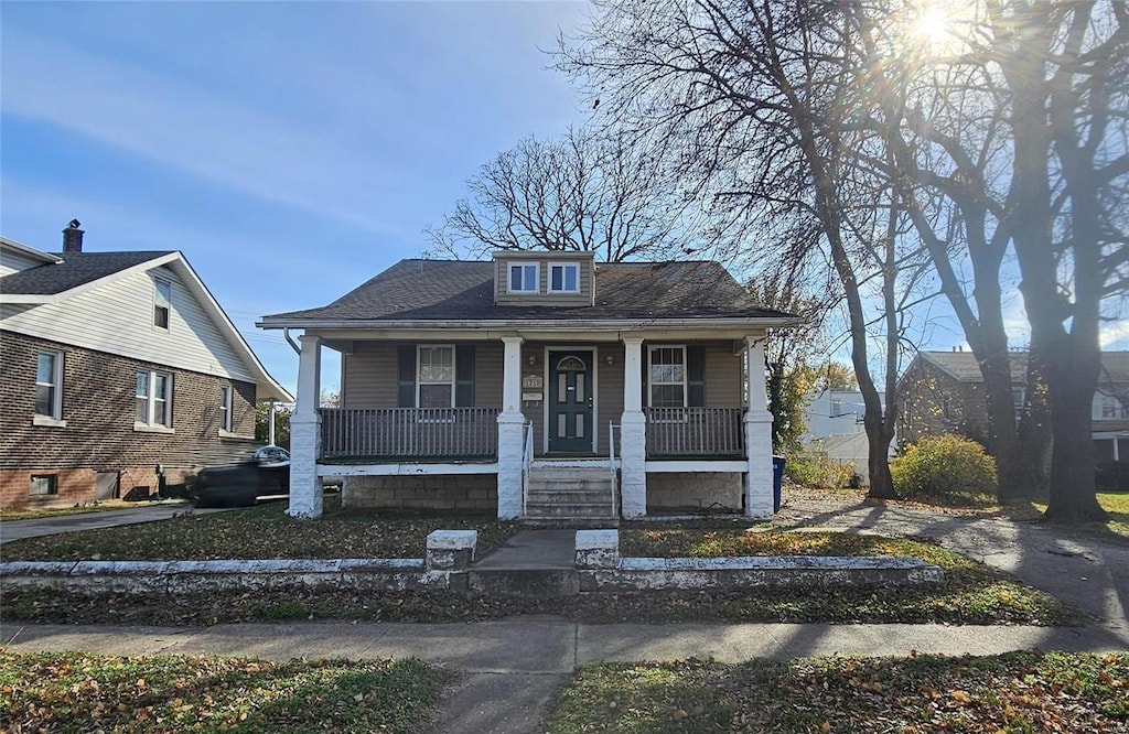 bungalow-style home with a porch