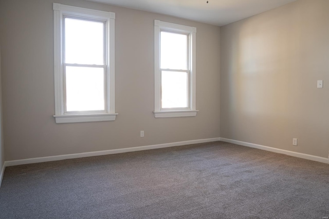 empty room with carpet and plenty of natural light